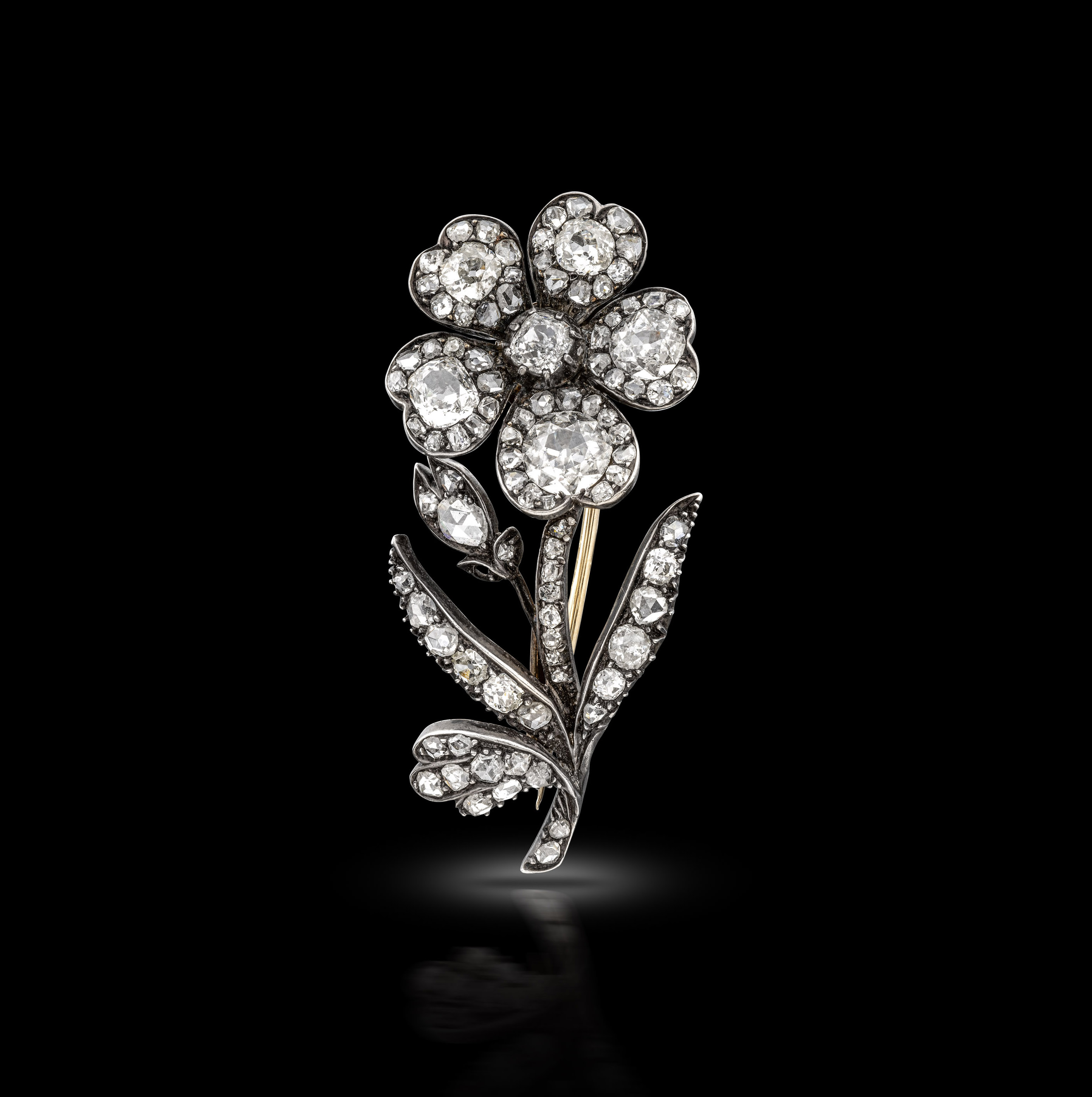 An en tremblant antique flower brooch